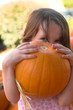 Photo: little girl holding pumpkin little girl holding pumpkin
