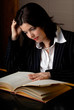 woman reading a law book