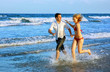couple enjoying themselves on the beach