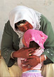 grandmother kissing a little girl grandmother kissing a little girl