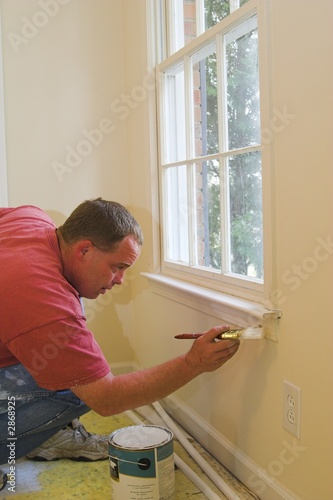 Photo: painter working inside home painter working inside home