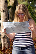 young woman reading a map young woman reading a map