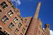 brick building and chimney tower