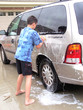 boy washing a van / car