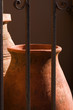 clay urns behind iron gate