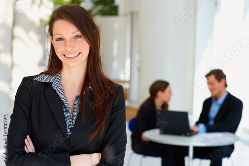 portrait of a young female in front of a workgroup