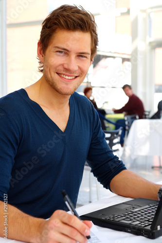 casual young man with his laptop