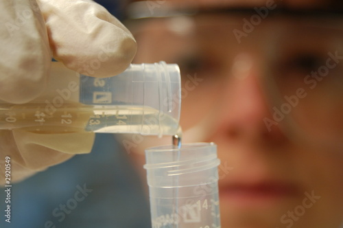 working in lab with test tubes