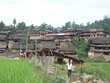 dong village with a woman bringing back some water, hunan, china
