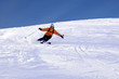ski rider in orange sharp turn
