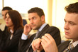 group of business persons at a conference, man in