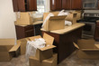 Photo: moving boxes in kitchen. moving boxes in kitchen.