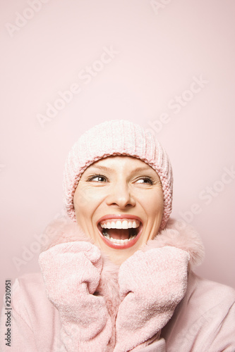 Photo: caucasian woman wearing winter coat and hat. caucasian woman wearing winter coat and hat.