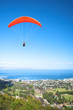 paraglider ridge soaring next to the mountain