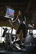 adult female on elliptical machine