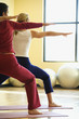 adult females in yoga class.