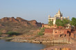 indian temple near a lac with mountains, jodhpur, india