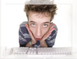 Foto: comical surprised teenager at computer comical surprised teenager at computer