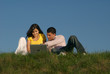 Photo: couple with laptop in nature couple with laptop in nature