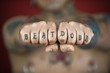 Adult male holding out fists reading beat down.