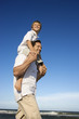 Photo: Dad carrying son on his shoulders. Dad carrying son on his shoulders.