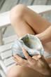 Girl holding conch shell.