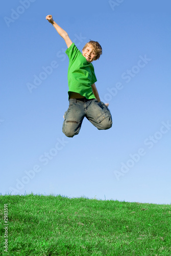 Photo: happy child jumping for joy happy child jumping for joy