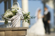 Flower basket with bride and groom.