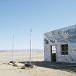 building in barren desert landscape.