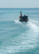 fisherman in a longtail boat