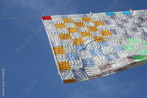 laundry - bright counterpane hanging to dry