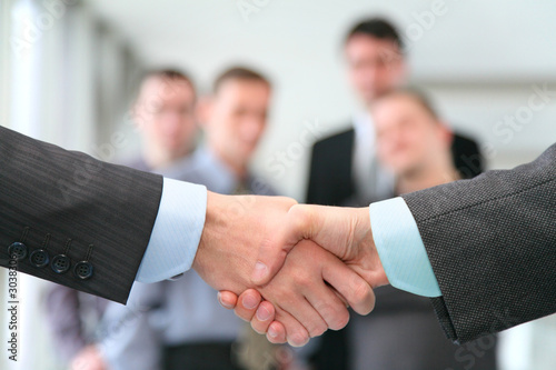 shaking hands with wrists