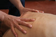hands massaging back