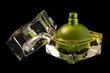 opened perfume bottle over black