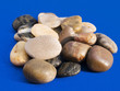 wet stones on blue background wet stones on blue background
