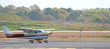 brown and white plane landing