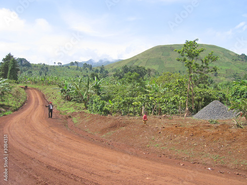dirty track spinning between the green hills, cameroon, africa