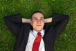 young businessman on green grass