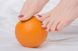 woman legs wth orange