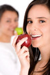 healthy girl eating an apple