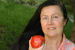 gorgeous older woman eating an apple