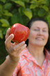 attractive mature woman holding an apple