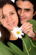 cute couple with a white flower
