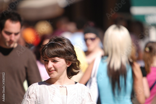 smilling casual girl in crowd