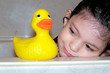 child with her rubber duck