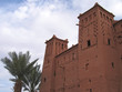moroccan fortress with a plam tree, ait benhaddou ksar, ouarzaza