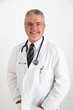 Foto: doctor with hands in pockets with big smile doctor with hands in pockets with big smile
