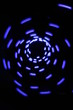 blue spiral abstract against black background. blue spiral abstract against black background.