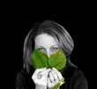 woman with green leaves