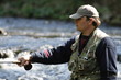 fisher in river